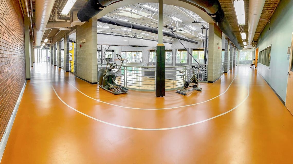 Indoor Running Track surrounding basketball court below