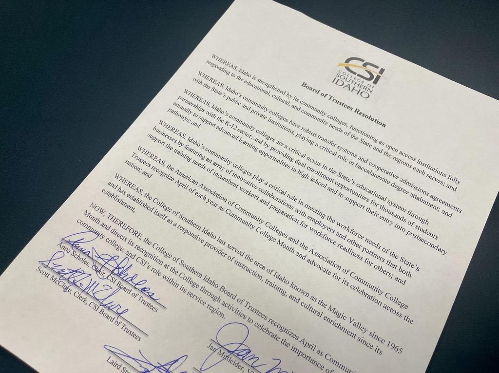 A signed document by the board of trustees recognizing April as community college month