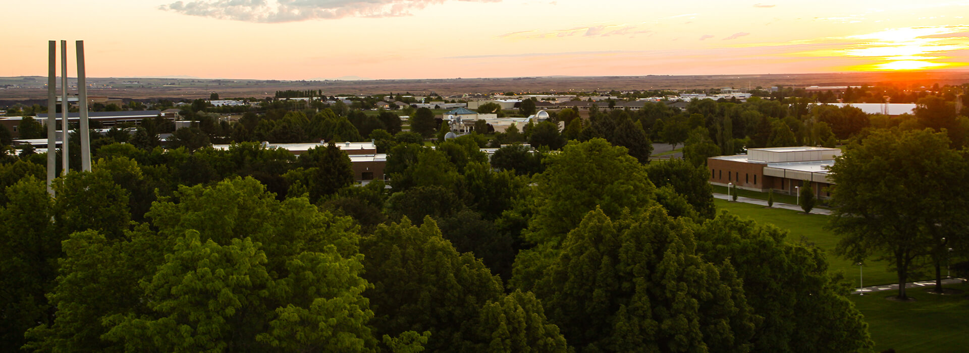 Dusk over campus with the canyon building, herrett center and bell tower in the foreground